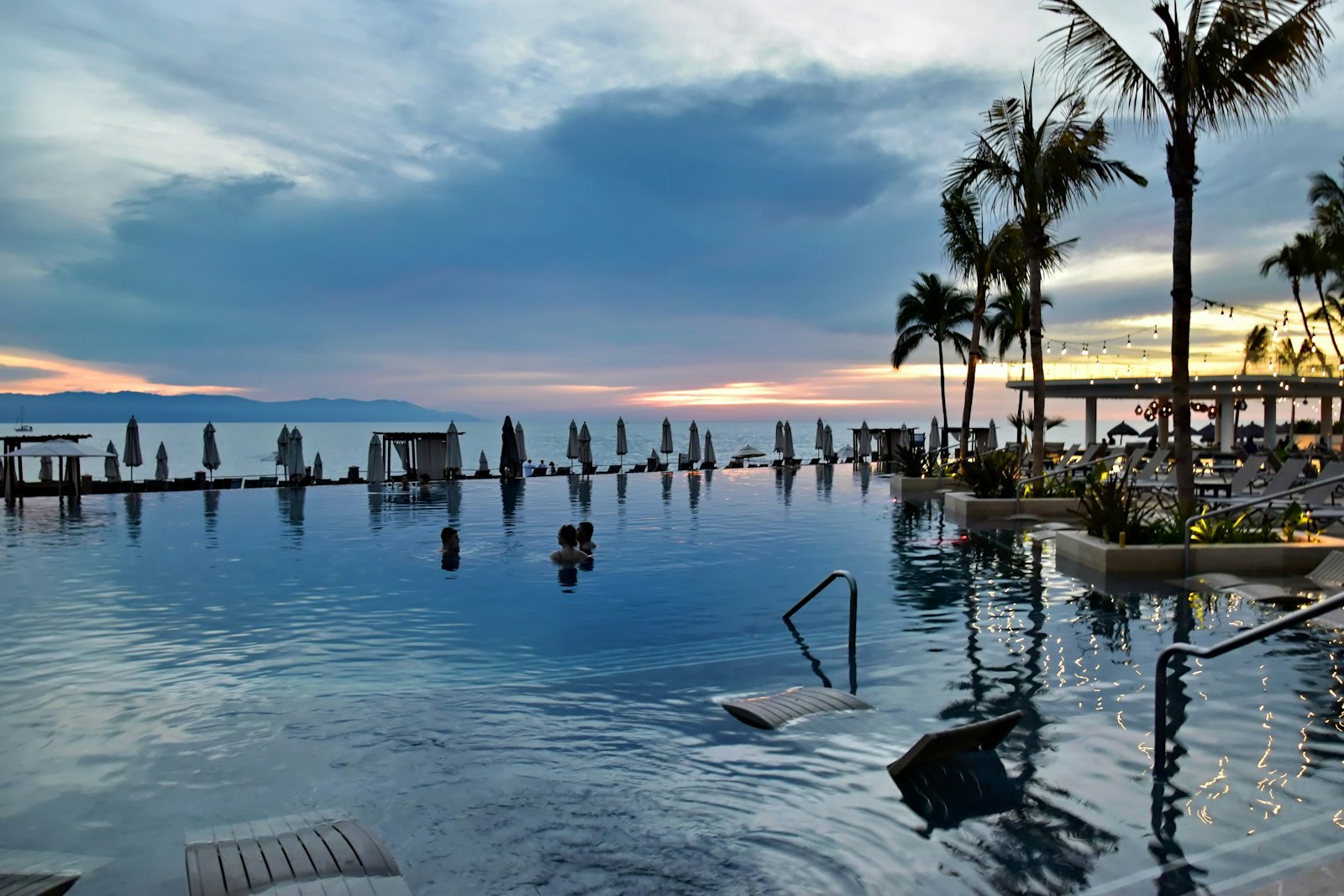 Infinity pool overlooking the ocean at sunset